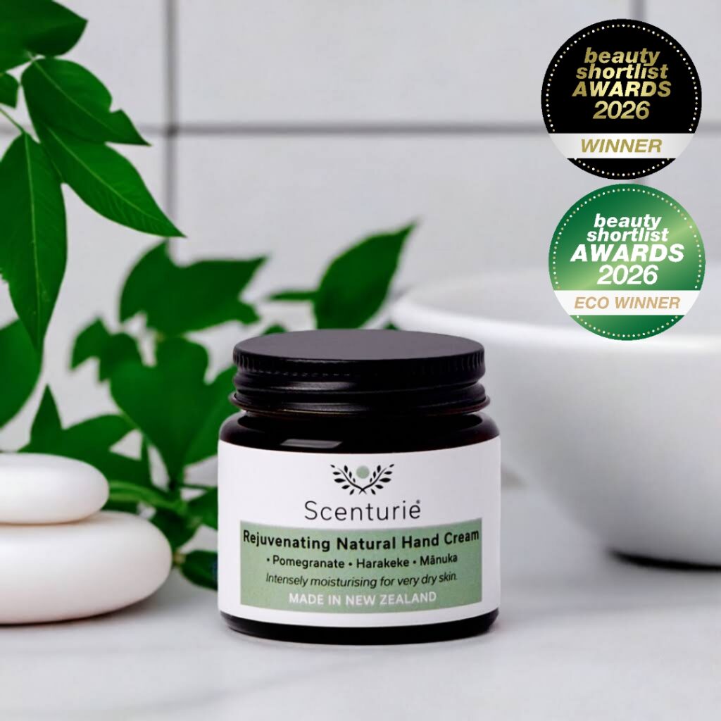 Glass jar of Scenturie Natural Hand Cream in bathroom setting with award logos for best plastic-free body product and best hand Cream 2026