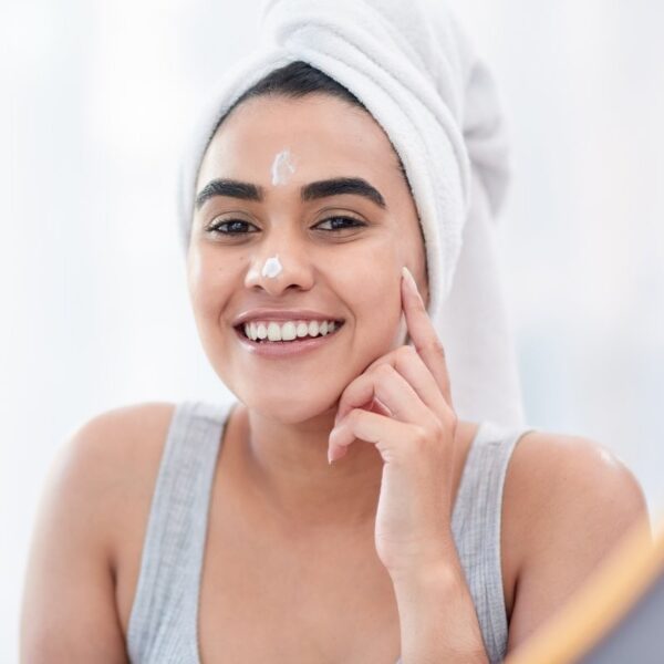 Woman applying Scenturie Natural Creamy Cleanser