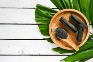 Bamboo charcoal and powder on wooden table