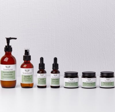 Scenturie's Ultimate Natural Skincare Set, showing all 7 full-sized products in their amber glass packaging.