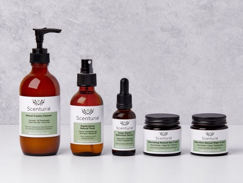 Scenturie Ultra-Hydrating Skincare Set featuring botanical cleanser, toner, serum, day cream, and night cream. Sustainable amber glass bottles. Expertly formulated by health science professional Tania Cibulskis to replenish the skin’s barrier using high-performance, plant-based ingredients handcrafted in New Zealand.