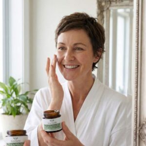 Woman applying Scenturie moisturiser