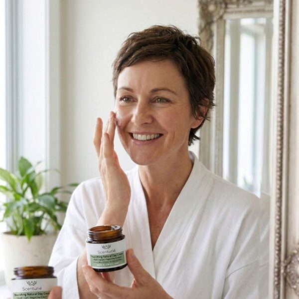 Woman applying Scenturie moisturiser
