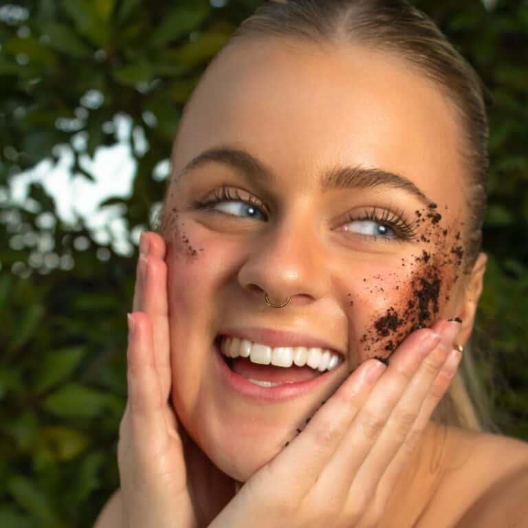 women using scrub on face