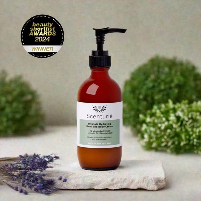 Scenturie's award-winning Ultimate Hydrating Hand and Body Cream in its 185ml amber glass bottle, styled in a minimalist bathroom. Winner of "Best Hand & Body Cream" at Beauty Shortlist Awards.
