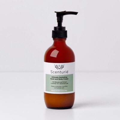 Scenturie Ultimate Hydrating Hand and Body Cream in its **185ml amber glass bottle**.