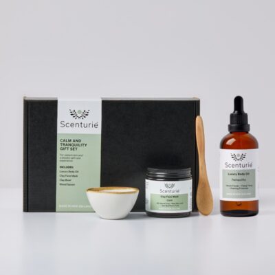 Scenturie Calm and Tranquility Spa Gift Set featuring a powder NZ Glacial Clay Face Mask, luxury aromatherapy Body Oil, porcelain mixing bowl, and wooden spoon. Handcrafted in New Zealand.