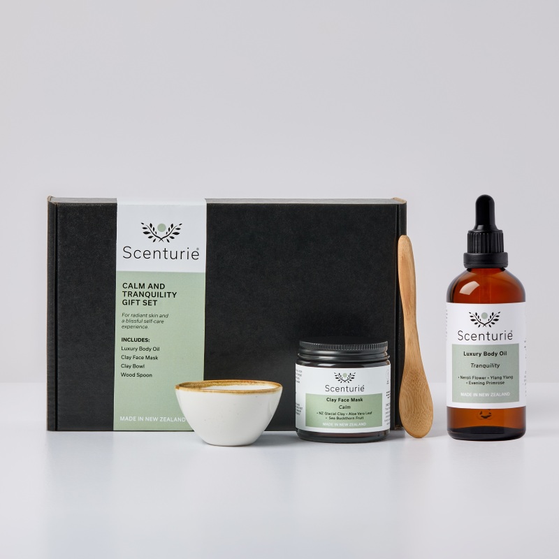 Scenturie Calm and Tranquility Spa Gift Set featuring a powder NZ Glacial Clay Face Mask, luxury aromatherapy Body Oil, porcelain mixing bowl, and wooden spoon. Handcrafted in New Zealand.