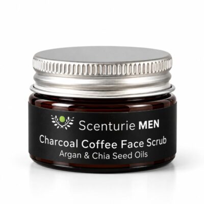 Scenturie men's charcoal and coffee exfoliating face scrub mini in a 15mL amber glass jar with black aluminium lid.