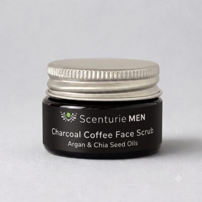15ml amber glass travel jar of Scenturie Men's Charcoal Coffee Face Scrub Mini with an aluminium lid.