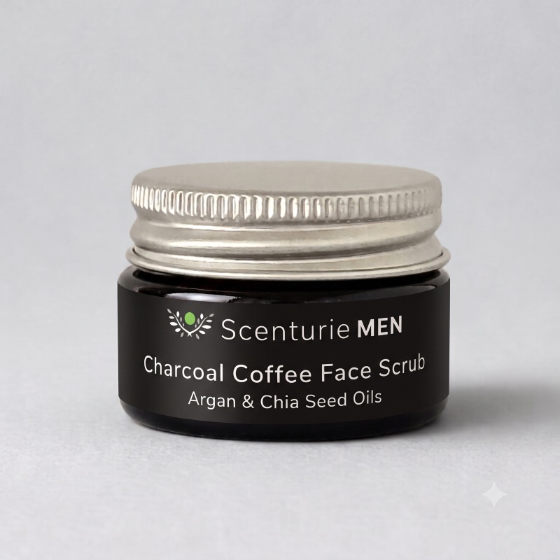 15ml amber glass travel jar of Scenturie Men's Charcoal Coffee Face Scrub Mini with an aluminium lid.