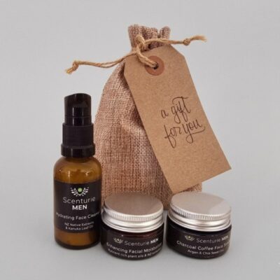 Scenturie Men’s skincare travel set featuring mini versions of the Hydrating Face Cleanser, Enhancing Facial Moisturiser, and Charcoal Coffee Face Scrub next to a hessian gift bag with a 'A gift for you' tag.