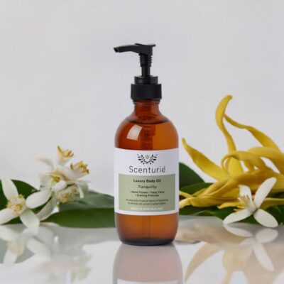Scenturie Tranquility Luxury Body Oil in an amber glass bottle. Relaxing floral body oil with Neroli and Ylang Ylang for glowing skin
