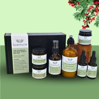 Scenturie's Celebrate Natural Beauty Gift Set, styled on a festive green background with Christmas mistletoe.
